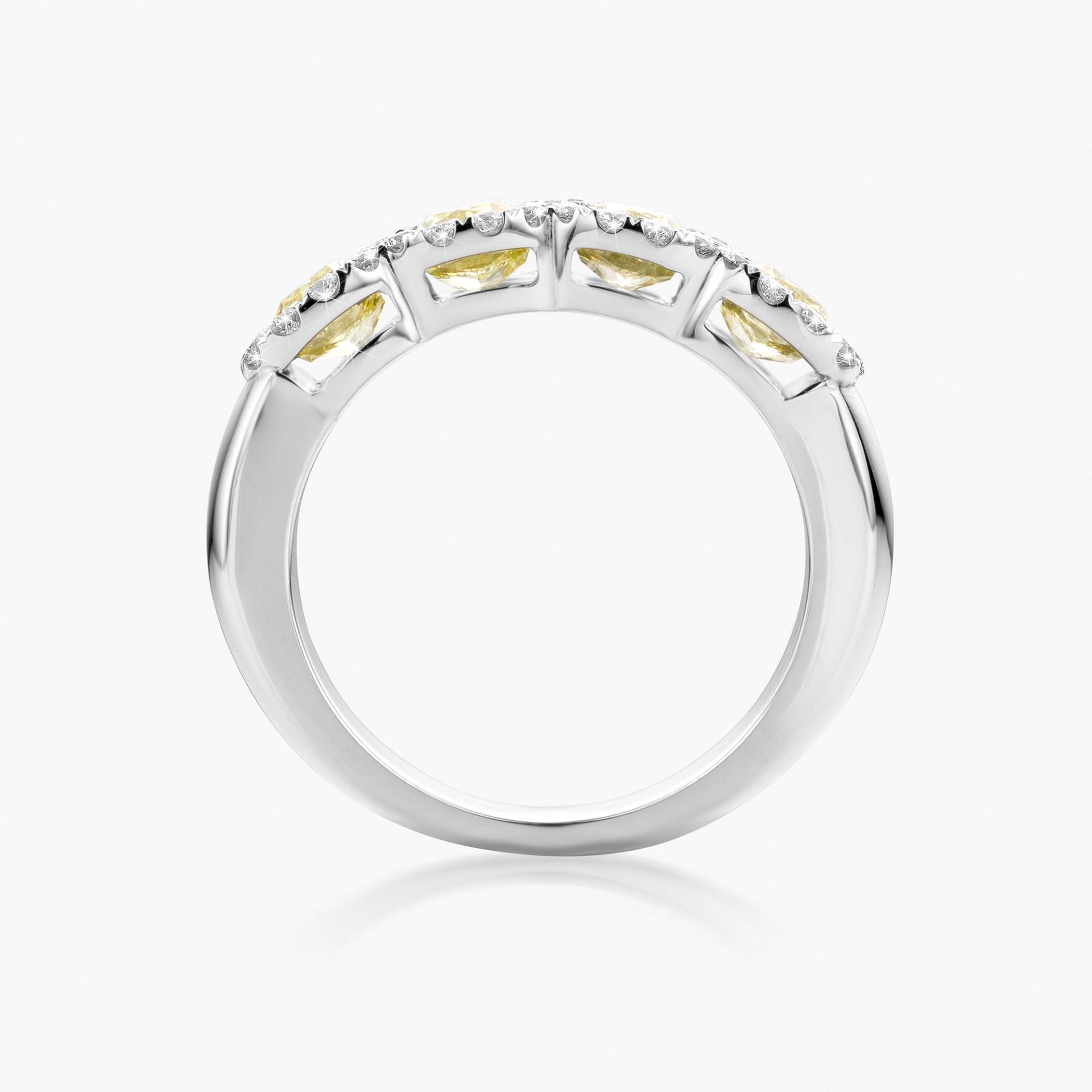 White gold ring set with cushion shaped yellow diamonds and diamonds made by Maison De Greef